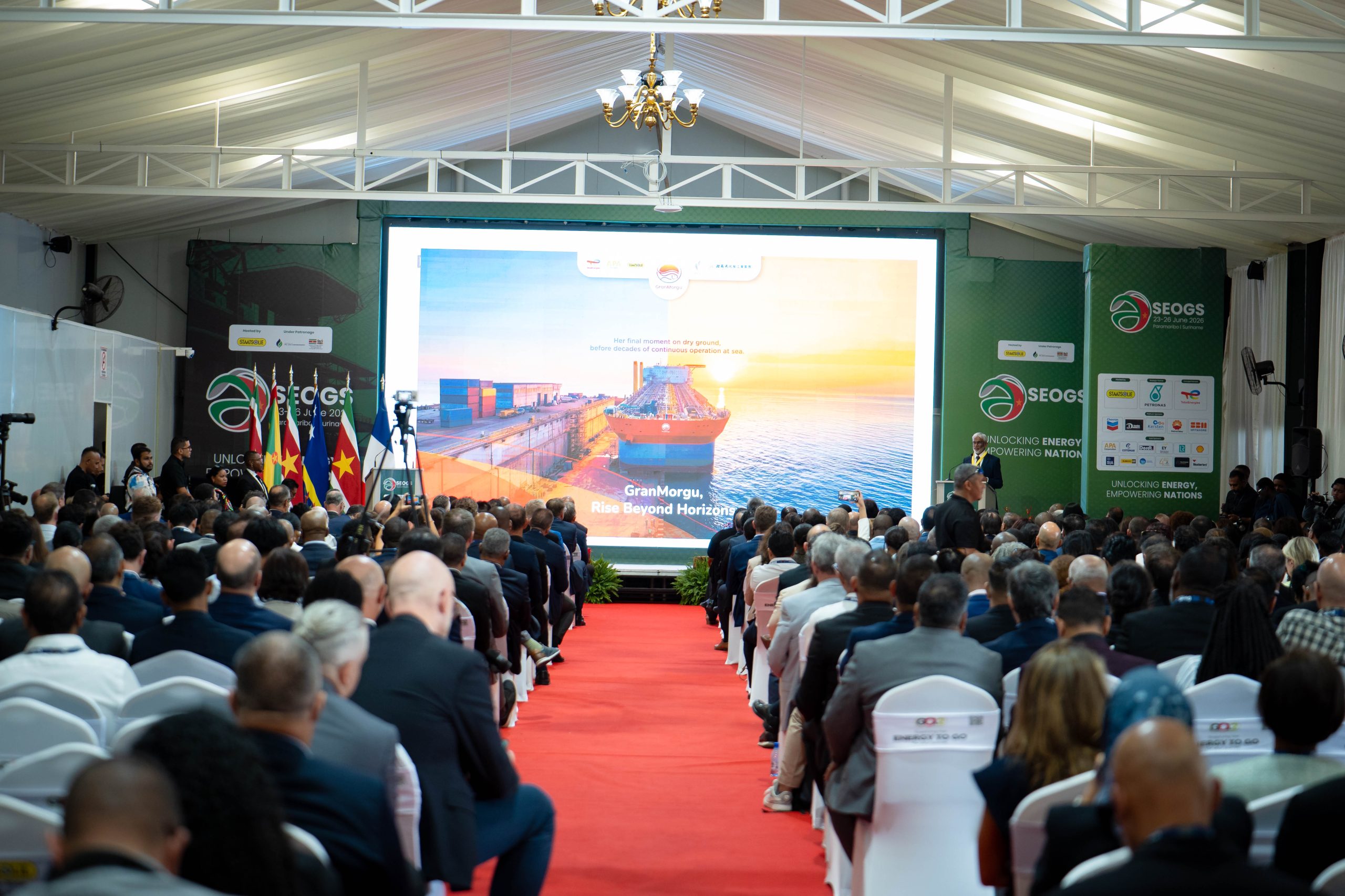Audience and stage at the SEOGS conference in Suriname